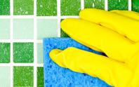 image of custodian scrubbing bathroom tiles